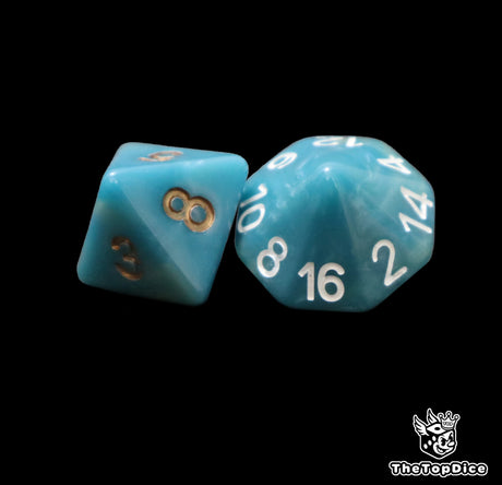 Close up of a blue D8 and D16 with gold numbers for scatter and long range rolls