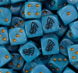 A pile of sky blue Seraphon dice with gold pips and black saurian masks