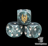 Close up of a metallic blue 16mm resin D6 die engraved with a gold sigil and silver pips