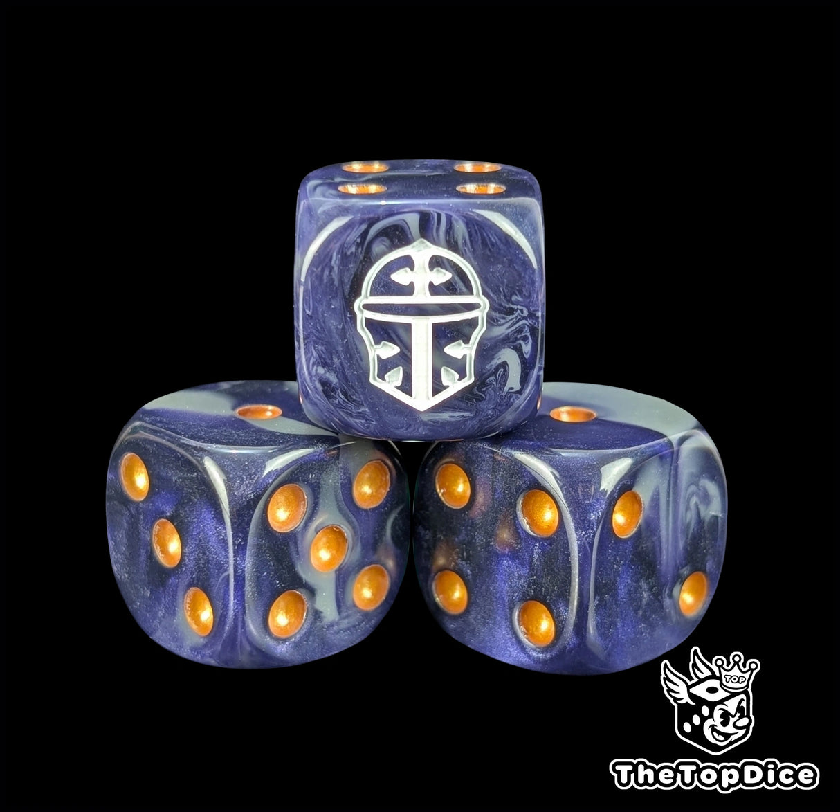 Close up of a blue and grey 16mm resin D6 die engraved with a white war helm and gold pips