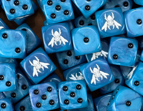 A pile of blue Tau D6 with black pips and white winged vespids