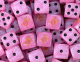 A pile of pink Emperor's Children D6 with gold Slaanesh runes