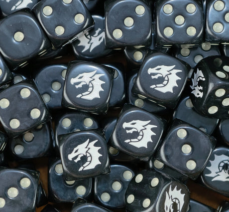 A pile of black Black Dragons dice with bone pips and white dragon heads
