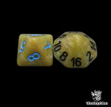 Close up of a bone white D8 and D16 with blue numbers for scatter and long range rolls