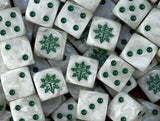 A pile of bone white Chaos Knight D6 with green helms and pips