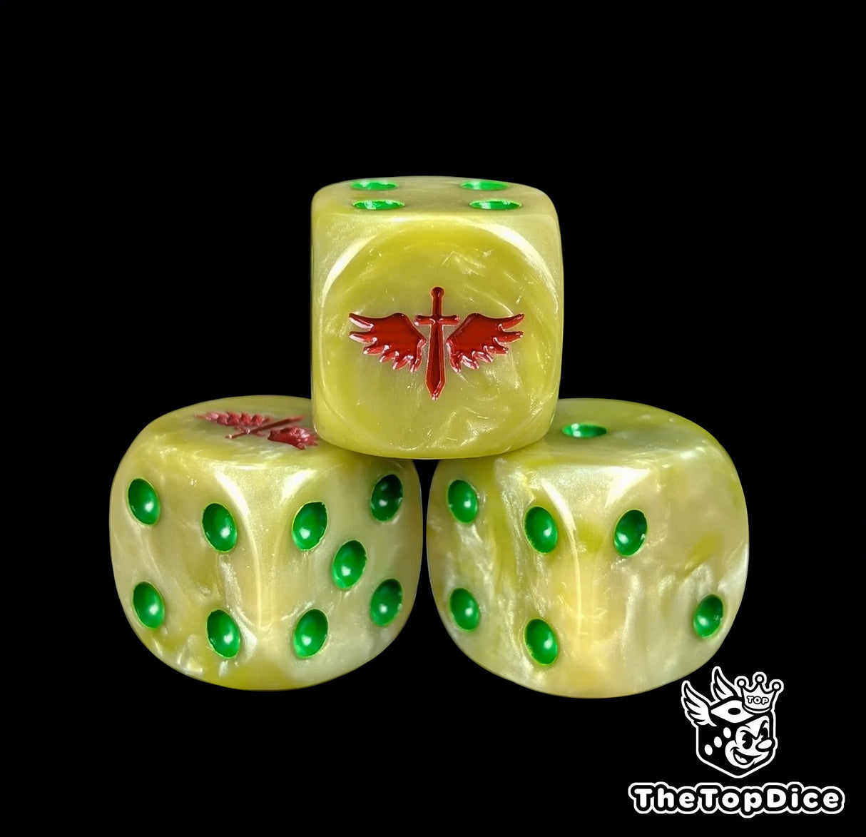 Close up of a bone white 16mm resin D6 die engraved with a red winged sword and green pips