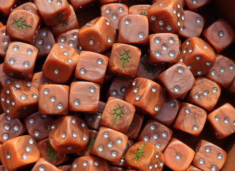 Pile of bronze 16mm D6 dice with green runes for a sci-fi undying army