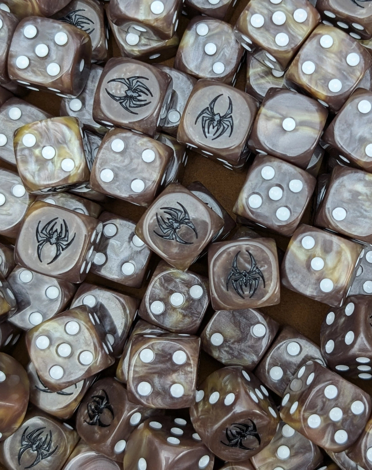 Pile of brown spider fang 16mm D6 dice for a monster fantasy miniature swarm