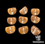 Amber brown D3 dice, nine of them set out three by three, numbered 1 to 3