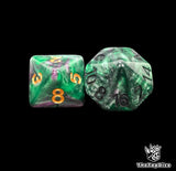 Close up of a green and purple D8 and D16 with gold numbers for scatter and long range rolls