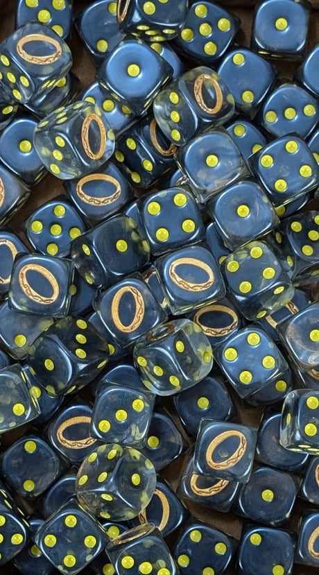 Pile of clear black ring of power 16mm D6 dice for a dark fantasy miniature army