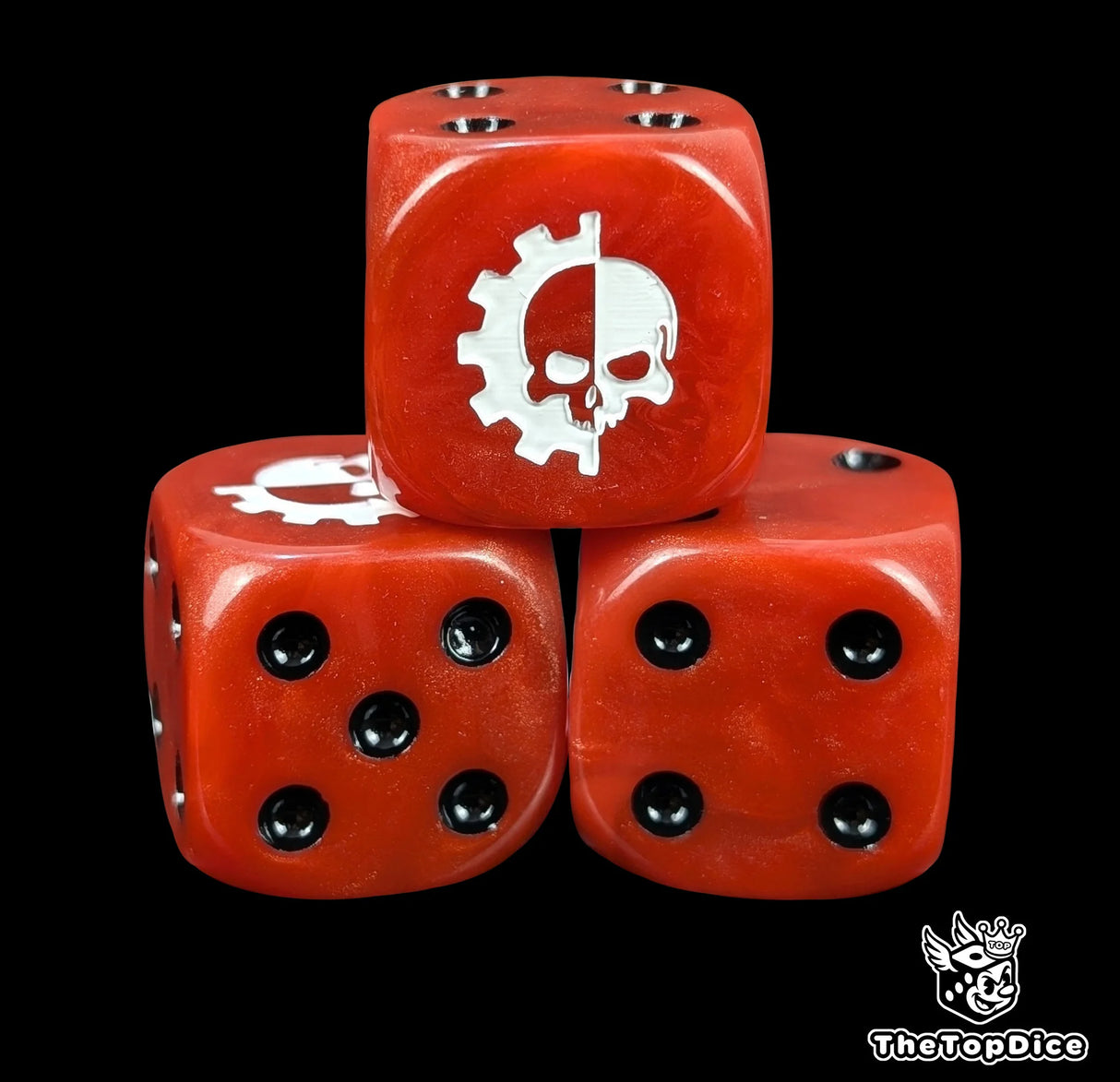 Close up of a red 16mm resin D6 die engraved with a white cog and skull and black pips