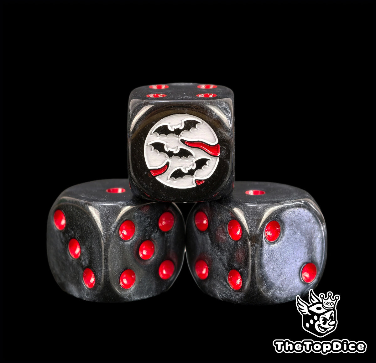 Three vampire dice in smoked black resin with blood red pips