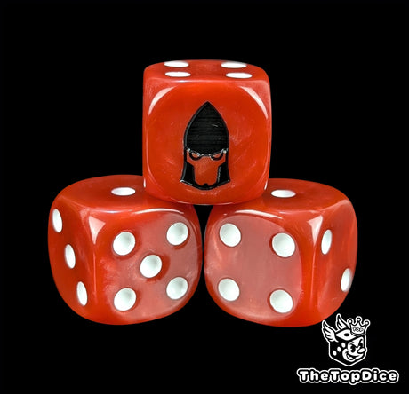 Close-up of a red D6 die with a black space elf profile