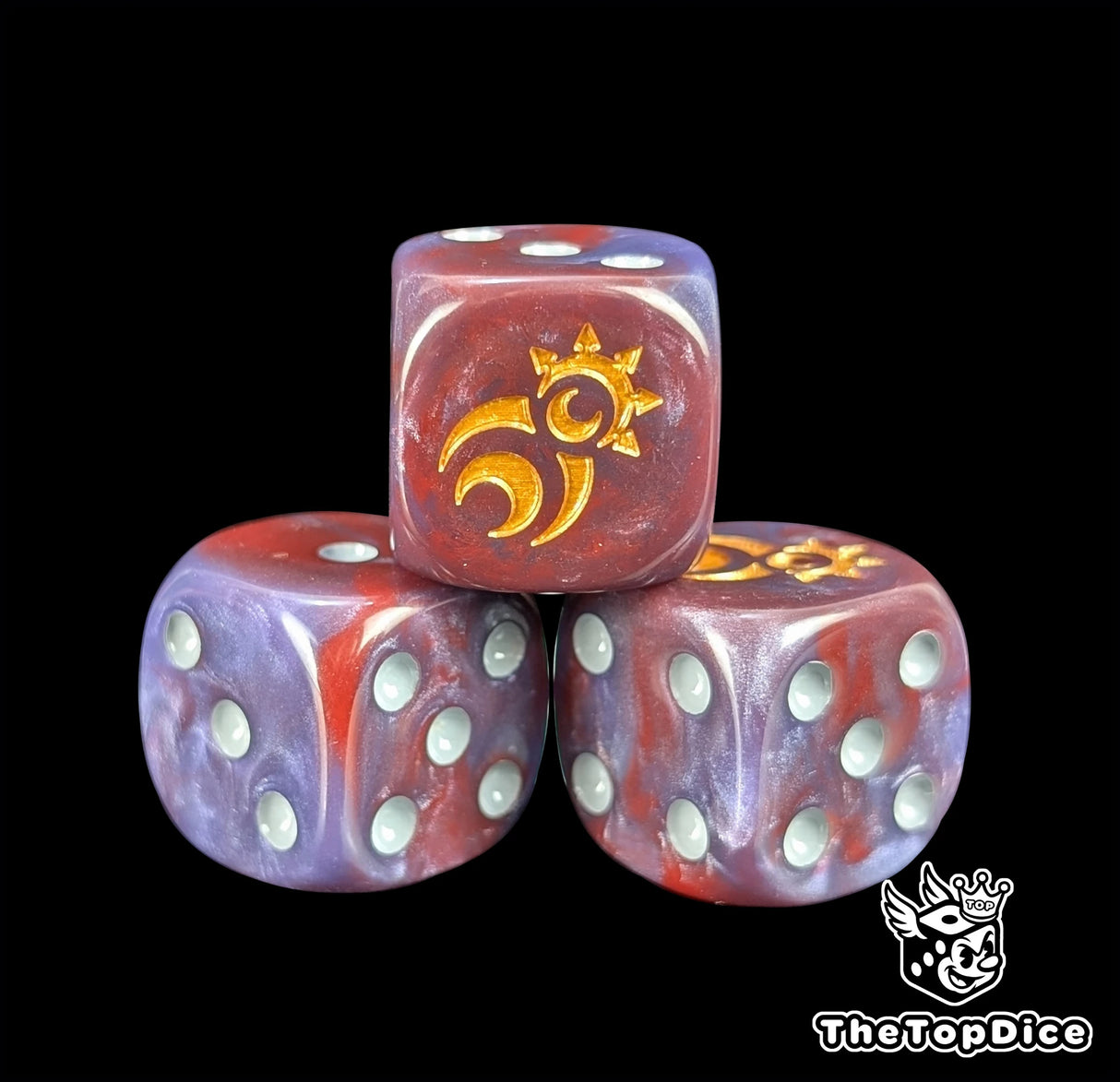 Close up of a crimson 16mm resin D6 die engraved with a gold spiral ringed by moons