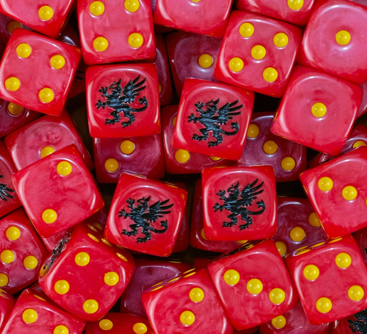 Pile of red Howling Griffons dice with yellow pips and black griffons