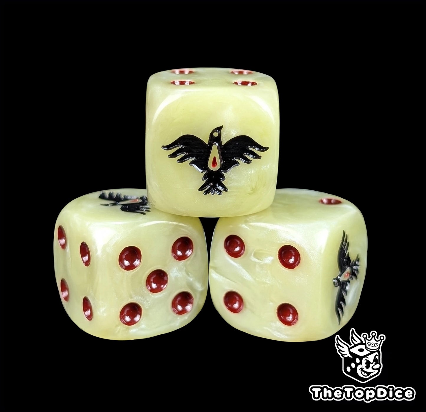 Close-up of a beige D6 die with a black raven and red blood drop