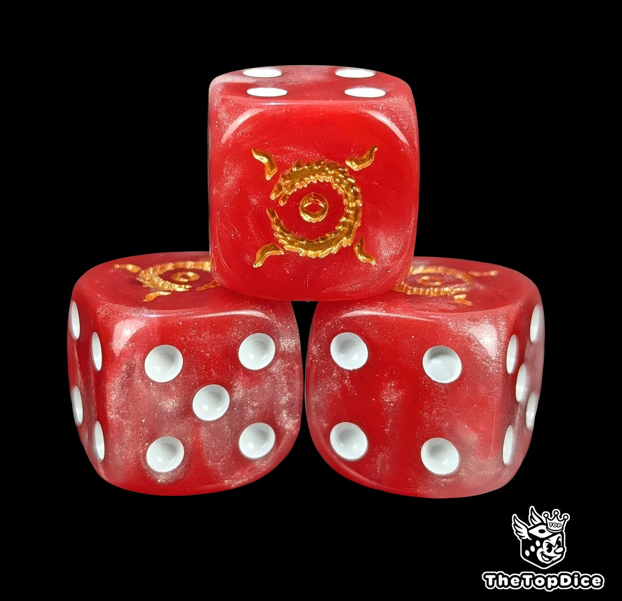Close-up of three red 16mm grimdark D6 dice engraved with a gold looping dragon emblem
