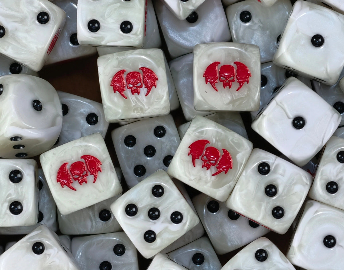 A pile of pearl white ghoul D6 with black pips and red winged skulls