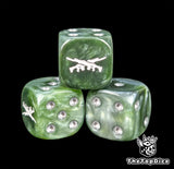 Close-up of a green D6 die with a crossed rifle emblem