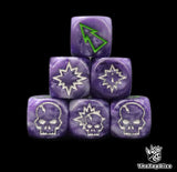 Close up of three purple 16mm block dice with green pips for resolving blocks