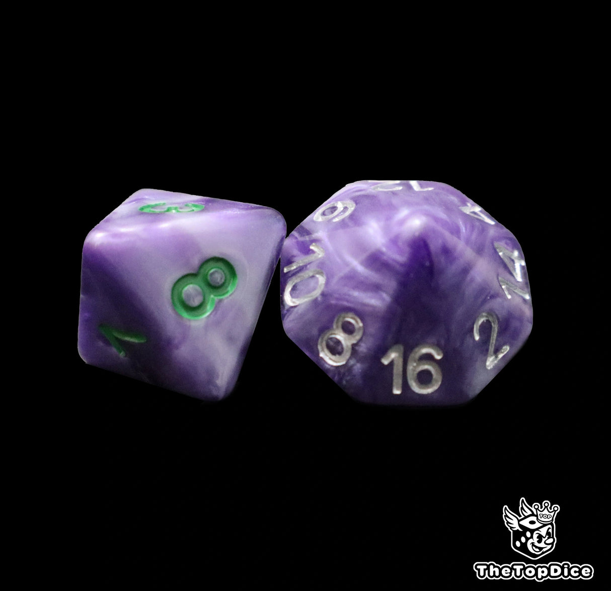 Close up of a purple D8 and D16 with green numbers for scatter and long range rolls