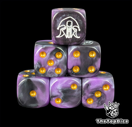 Purple and black resin D6 dice with a white jester emblem and gold pips