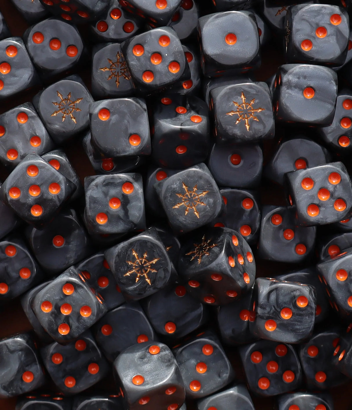 Pile of black 16mm D6 dice with gold stars for a sci-fi chaos army