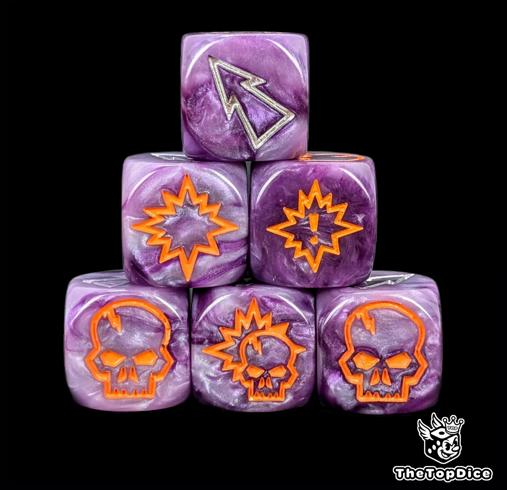Close up of three purple 16mm block dice with silver pips for resolving blocks