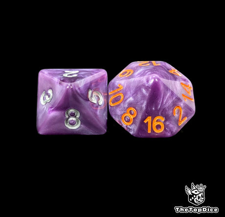 Close up of a purple D8 and D16 with silver numbers for scatter and long range rolls