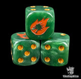 Close up of a green 16mm resin D6 die engraved with a gold drake head wreathed in orange fire