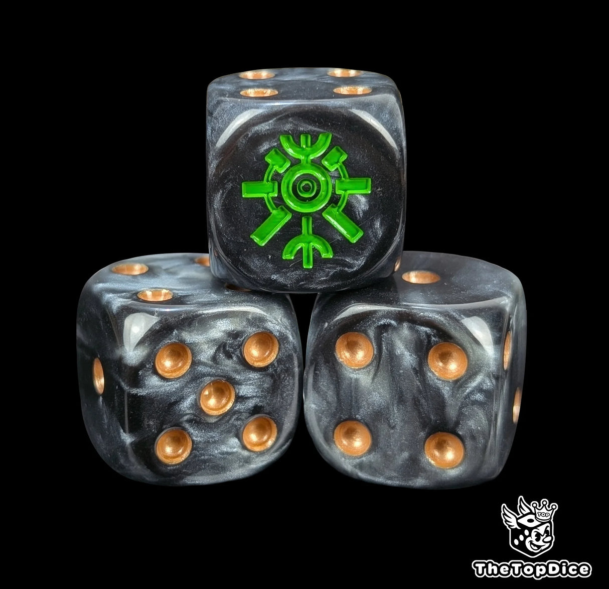 Close-up of three black and grey 16mm grimdark D6 dice engraved with a green tomb rune emblem