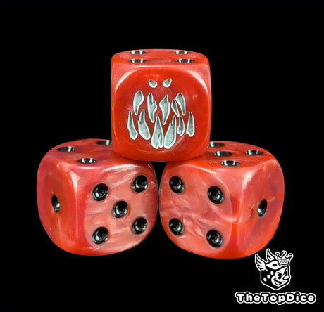 Close-up of a red fanged monster D6 die for fantasy armies