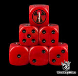 Farsight Enclaves Tau Empire dice, red 16mm resin D6 with black pips and a black tau emblem holding a white sword, stacked in a pyramid