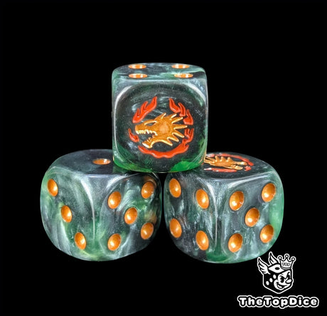 Close up of a green 16mm resin D6 die engraved with a gold drake face wreathed in orange flame