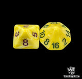 Close up of a yellow D8 and D16 with green numbers for scatter and long range rolls