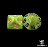 Close up of a green D8 and D16 with gold numbers for scatter and long range rolls