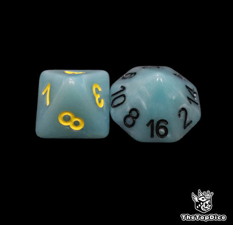 Close up of a sky blue D8 and D16 with yellow numbers for scatter and long range rolls