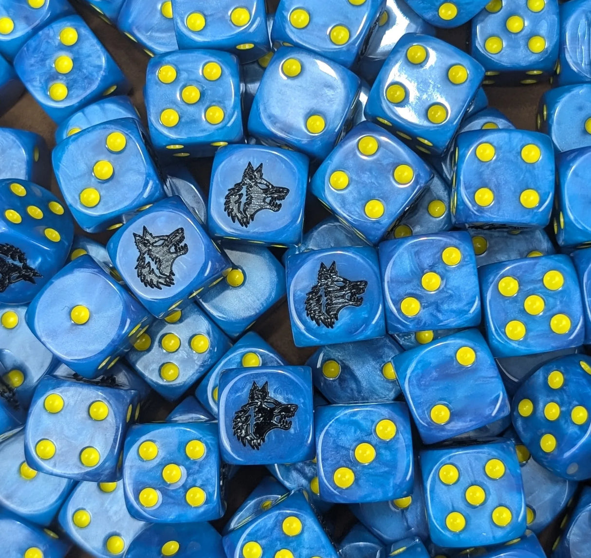Pile of blue wolf 16mm D6 dice for a sci-fi knight army