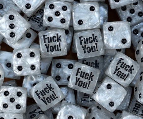 A pile of pearl white meme dice with black pips and a Fuck You print