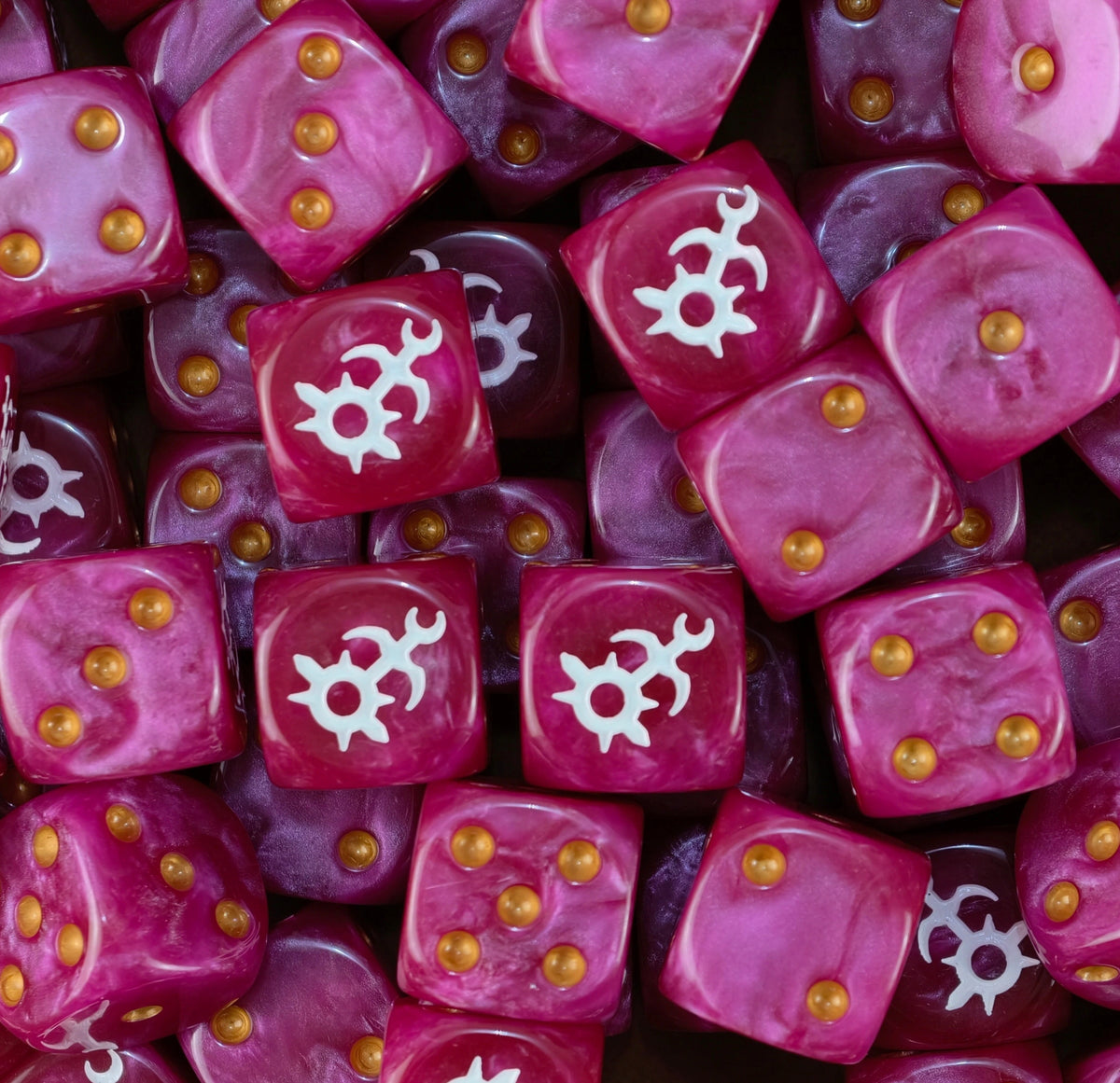 Pile of magenta Slaanesh dice with gold pips and white chaos spirals