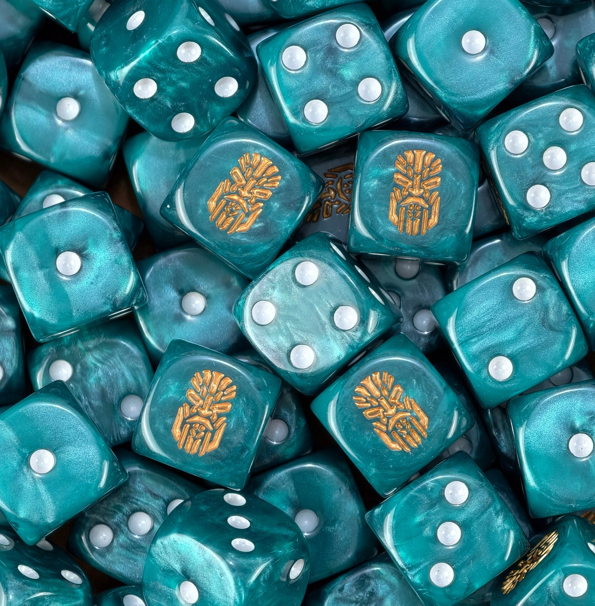 A pile of teal Votann D6 with white pips and gold kin runes