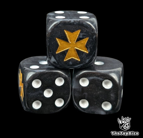 Close-up of three black and grey 16mm grimdark D6 dice engraved with a gold crusader cross emblem