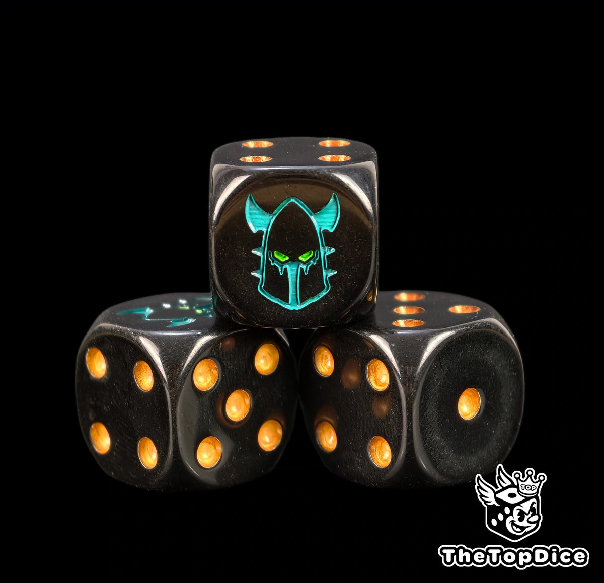 Three dark eldar dice in black resin with warm gold pips