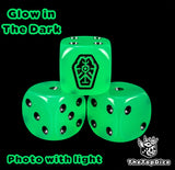 Close up of a glow in the dark green 16mm resin D6 die engraved with a black tomb rune and black pips