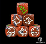 Close up of three red and blue 16mm block dice with green pips for resolving blocks