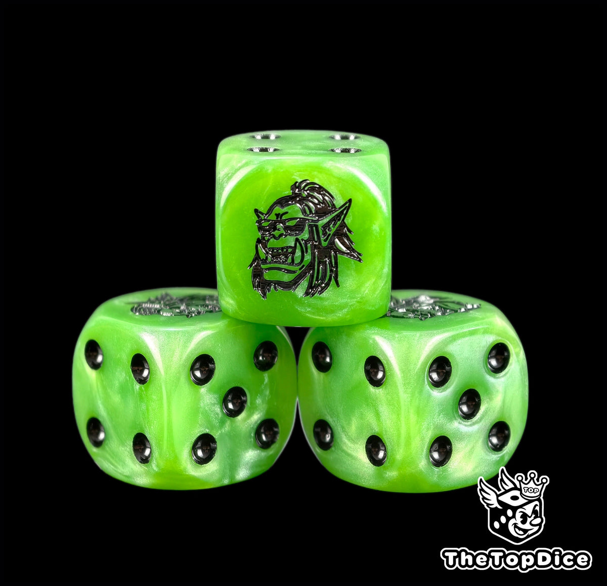 Three green orc dice with a grinning goggled orc boss face