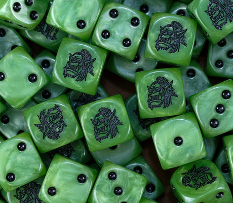 A pile of green orc D6 with black pips and goggled orc faces