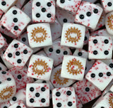 A pile of blood flecked World Eaters dice with a gold toothed maw
