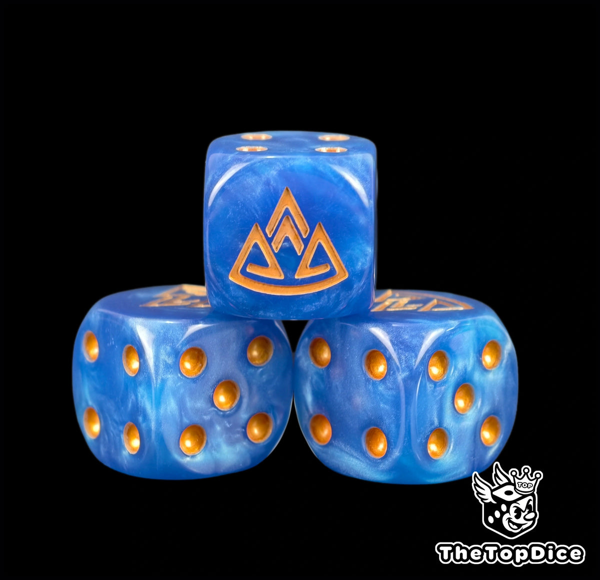 Three blue Old World dwarf dice with a gold mountain rune